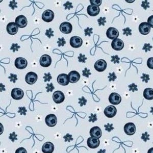 May include: A light blue pattern featuring watercolor blueberries, bows, and small white flowers. The design is repeated across the surface, creating a seamless and whimsical aesthetic. The blueberries are a deep indigo color.