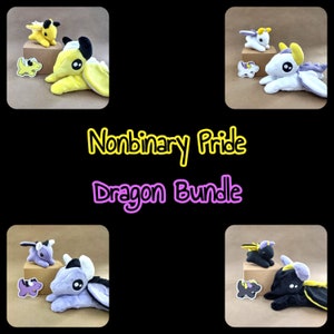 May include: A set of three plush dragon toys in a non-binary pride colour scheme. The dragons are yellow, purple, and black with yellow, purple, and black accents. The dragons are all in a sitting position with their wings spread out. The text "Nonbinary Pride Dragon Bundle" is written in yellow and purple letters on a black background.