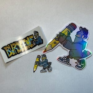 May include: Three stickers featuring a cartoon pigeon with a yellow pencil. One sticker has the word "BURDENE" in yellow and blue letters. The other two stickers feature the pigeon holding a yellow pencil, one is larger than the other.