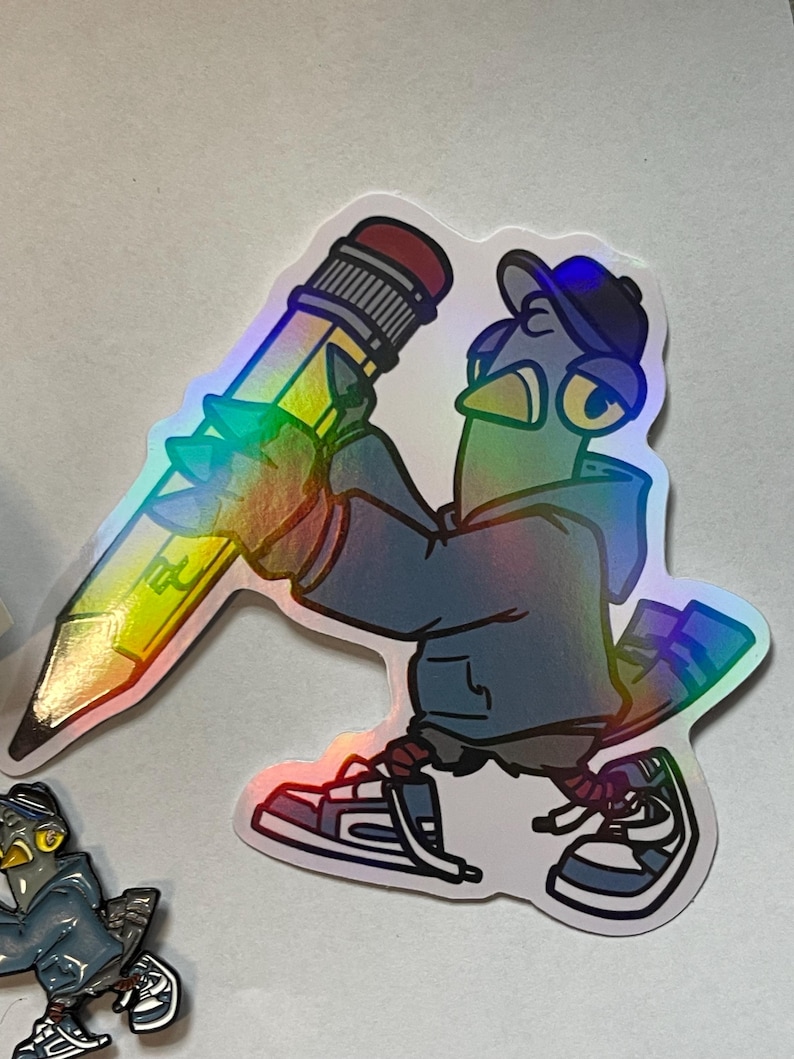 May include: A holographic sticker of a blue bird wearing a baseball cap and holding a yellow pencil. The bird is wearing a blue jacket and sneakers.