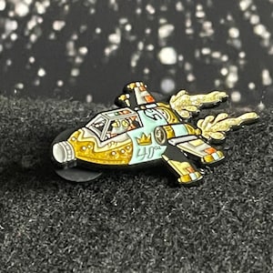Cap in Space.    1.5 ” double Prong Soft Enamel Hat/Lapel
