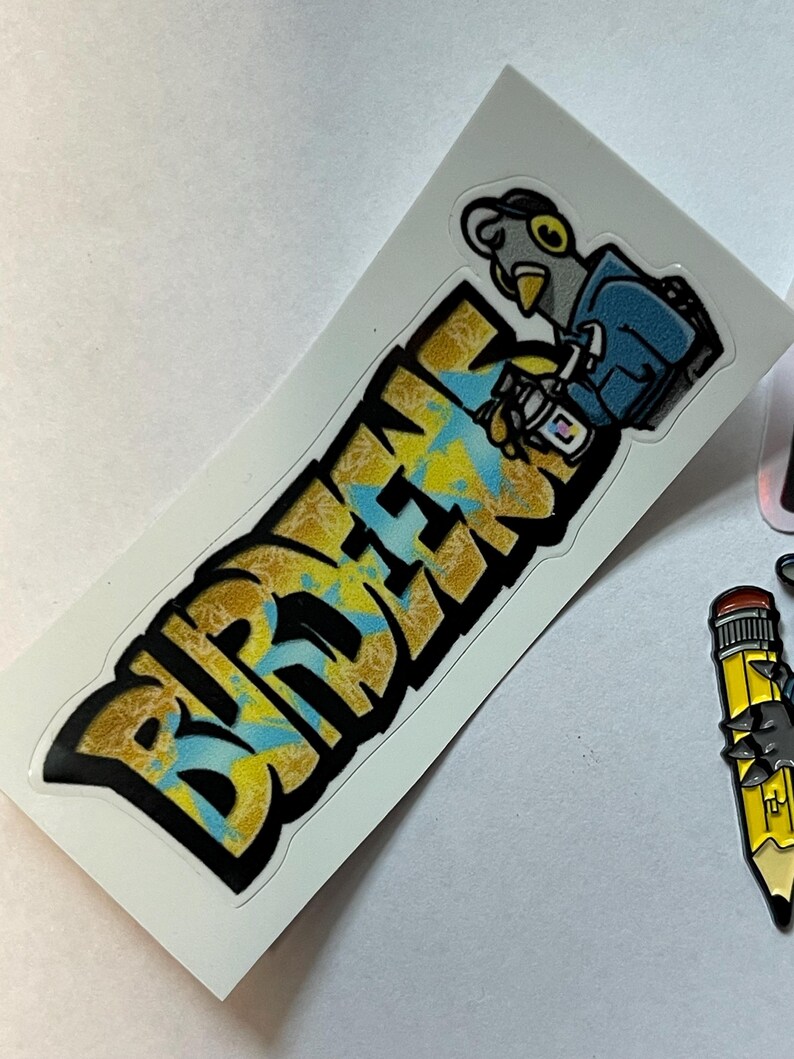 May include: A sticker with a cartoon bird holding a cup of coffee and the word "BIRDMEN" in yellow and blue graffiti style.