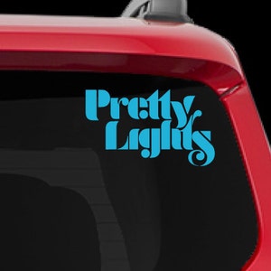 May include: A red Jeep with a blue vinyl decal on the back window that says "Pretty Lights".