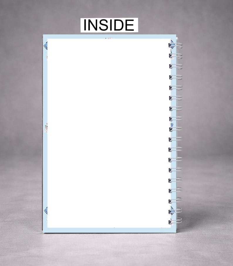 May include: A spiral-bound notebook with a light blue border and white pages. The word "INSIDE" is printed in black at the top. The notebook is open, revealing blank pages, and is set against a gray background.