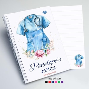 May include: A white spiral bound notebook with a blue watercolour illustration of a nurse's uniform with a stethoscope and the word "NHS" on the pocket. The notebook has the text "Penelope's notes (example text)" and a small illustration of a nurse's uniform in the bottom right corner.