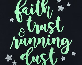 May include: A black background with the text "faith & trust running dust" in green lettering. There are silver glitter stars scattered around the text.