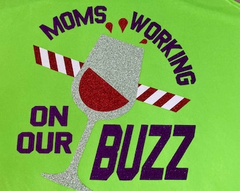 Moms Working on our BUZZ fun running / drinking shirt - perfect for magical race weekend! Glitter design on wicking running tank / cotton T