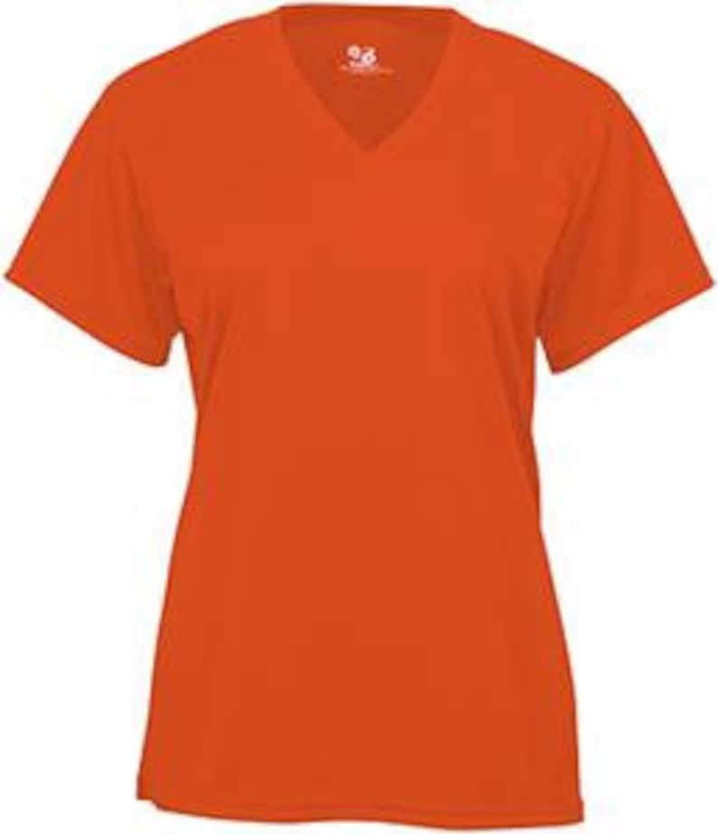May include: Orange short-sleeved v-neck t-shirt.