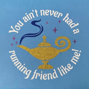 May include: A light blue t-shirt with a white graphic of a genie lamp and the text "You ain't never had a running friend like me!"