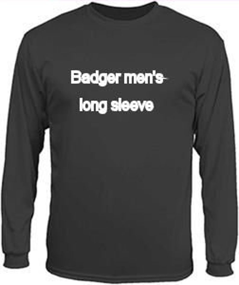May include: A black long-sleeve shirt with the text "Badger men's long sleeve" printed in white across the chest. The shirt has a crew neck and ribbed cuffs.