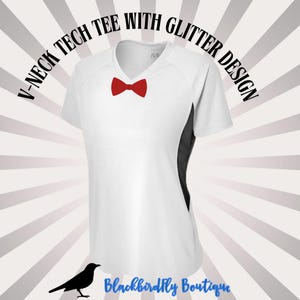 May include: White V-neck tech tee with a red glitter bow tie design. The shirt has black side panels and the text "V-NECK TECH TEE WITH GLITTER DESIGN". A black bird silhouette and the text "Blackbirdfly Boutique" are at the bottom.