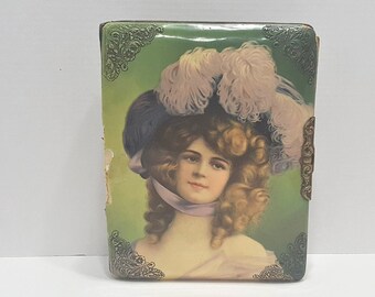 possibly Brundage Victorian Celluloid Photo Album depicting an Adorable Girl holding Her Kitten