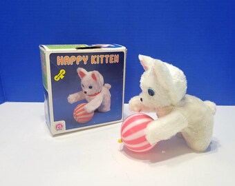 Vintage Happy Kitten witte kat geanimeerd speelgoed speelt met bal