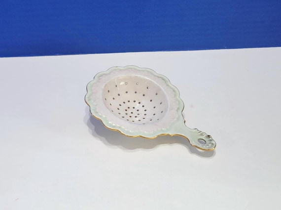 Antique White Porcelain Tea Strainer with Green Accents