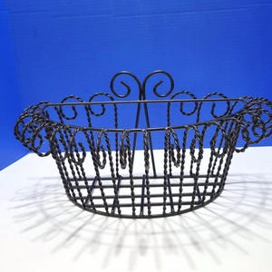 Cesta colgante de pared vintage de alambre francés negro con diseño torcido para jardín