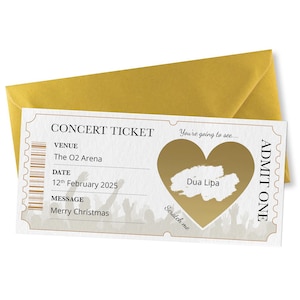 Może przedstawiać: Złoty bilet na koncert z ukrytym pod warstwą do zdrapania sercem, kt&oacute;re po zdrapaniu ukazuje napis "Dua Lipa". Na bilecie widnieje napis "You're going to see..." oraz "ADMIT ONE". Zawiera r&oacute;wnież informacje o miejscu, dacie i wiadomość: "The O2 Arena", "12th February 2025" oraz "Merry Christmas".