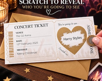 May include: A rectangular concert ticket featuring a gold heart scratch-off section that reveals the text Harry Styles. The ticket displays the text CONCERT TICKET, Venue The O2 Arena, Date 12th February 2025, and Message Merry Christmas, printed on white cardstock.