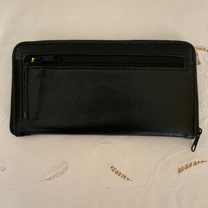Cartera multicompartimentos de piel sintética negra*