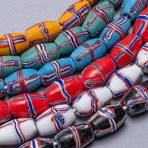 May include: A close-up of a string of colorful glass beads. The beads are cylindrical and have a striped pattern. The colors of the beads include red, blue, yellow, green, white, and black.