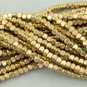 220 Rounded Cube Brass Spacer Beads. 3mm with 1.5mm Hole 214 Beads on 24" Strand SKU-MB-52-B