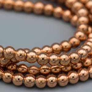 Copper on Brass Smooth Round 5x6mm Bead 125 Beads on 24&quot; Strand SKU-MB-17-C