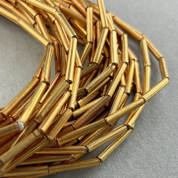 Brass Gold Tube Spacer Beads. 10x1mm. 64 Beads on 24" Strand. MB-70-G