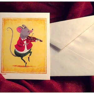 May include: A greeting card featuring a cartoon mouse playing a violin. The mouse is wearing a red jacket, green pants, and a bow tie. The background is yellow with a brown frame.