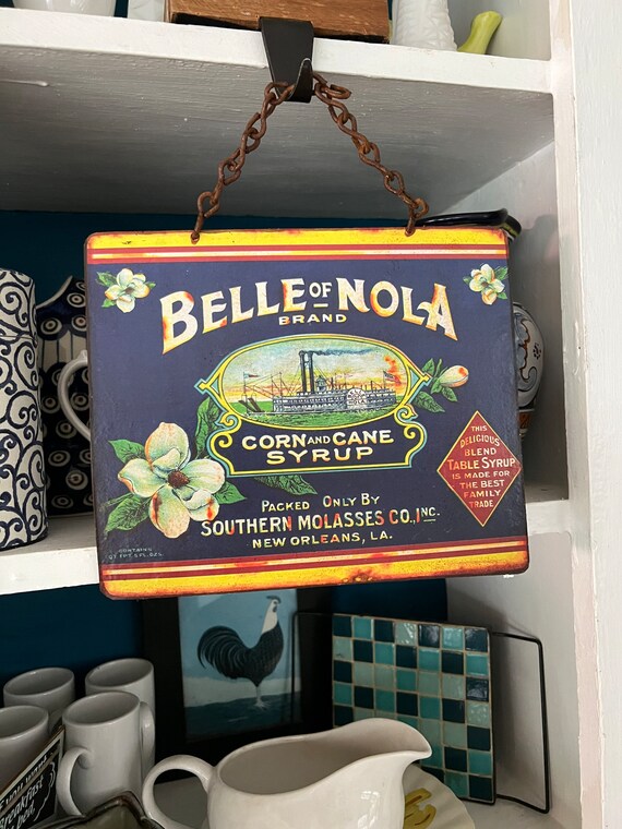 VINTAGE METAL SIGNS Southern New Orleans Tin Sign, Wall Decor Food Label, “Belle of Nola” Corn and Cane Syrup.