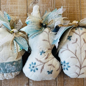 May include: A rustic wooden sign with the text "Welcome to our home" in white lettering. The sign features a distressed finish and a simple, inviting design, perfect for a front porch or entryway.