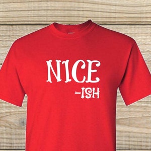 May include: Red t-shirt with white text that reads "NICE -ISH".