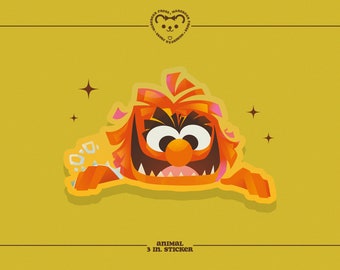 May include: Orange and red cartoon monster sticker with a toothy grin and big eyes. The sticker is 3 inches in diameter and has a shiny finish.