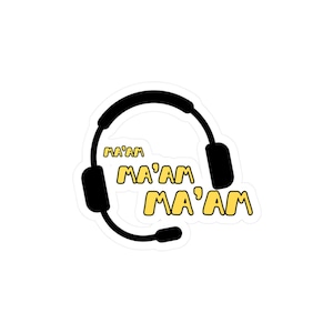 May include: A black headset with a microphone and the text "Ma'am" repeated three times in yellow.