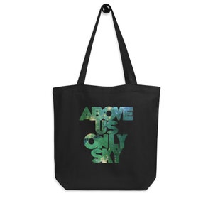 May include: Black tote bag with a galaxy print design and the text "ABOVE US ONLY SKY" in white.