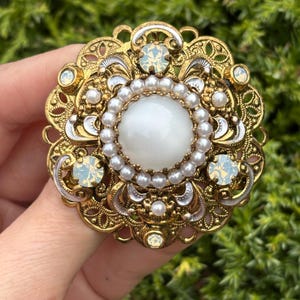 Vintage Germany signed brass filigree and enamel layered brooch with white glass cabochon, rhinestones, and faux pearl - estate find