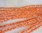 5mm Czech Glass Fire Polish Orange Coral lined Crystal