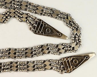 Antique silver dress ornament