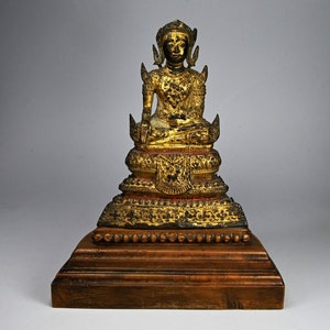 Antique Rattanakosin bronze statue with wooden basement