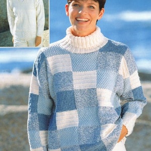 May include: A blue and white checkered knit sweater with a high neck. The sweater is made of a soft, textured yarn.