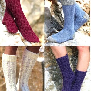 May include: Four pairs of knitted socks in different colors and patterns. The socks are shown on a model's legs and are displayed against a rocky background. The socks are all one size and are for adults.