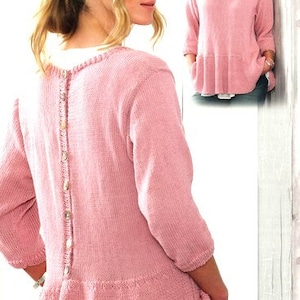 May include: A pink knitted sweater with a button-up back and a ruffled hem.