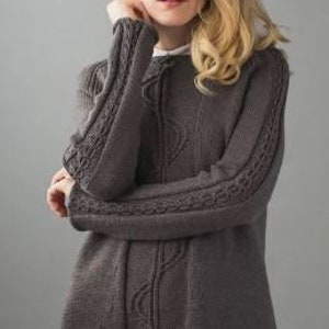 May include: A grey knitted jumper with a cable knit pattern on the sleeves and a textured design on the front.