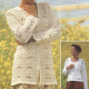 May include: A white crocheted cardigan with a delicate openwork pattern. The cardigan has a long, loose fit and features a button-up front.