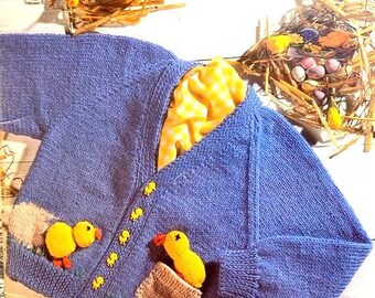May include: A blue knitted baby cardigan with yellow duck appliques and a yellow and white checkered fabric detail. The cardigan has a button closure and pockets.