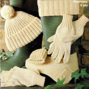 May include: A set of knitted accessories in a cream color, including a hat, gloves, and leg warmers. The items are made with a 5-ply yarn and are displayed on a green background.