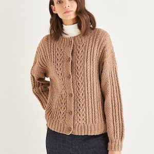 May include: A tan cable-knit cardigan with a button-up front. The sweater has a textured design with vertical ribbing and a central cable pattern. The long-sleeved cardigan is made of a soft, warm material.