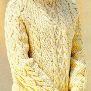 May include: Cream-colored cable-knit sweater with a crew neck and long sleeves. The sweater features a textured pattern of braided cables and a ribbed hem and cuffs. The yarn appears to be a soft, natural fiber, suitable for cooler weather.