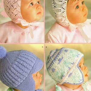 May include: Four baby bonnets in various styles. The top left bonnet is pink with a lace design. The top right bonnet is white with a floral lace design. The bottom left bonnet is blue with a pom-pom. The bottom right bonnet is white, blue, and green.