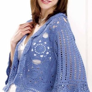 May include: A light blue crocheted shrug with a scalloped hem and openwork design. The shrug has a loose fit and is perfect for layering.