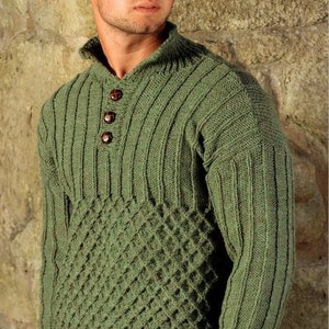 May include: A green knitted jumper with a button-up collar and a diamond pattern on the front.