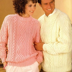 May include: A pink and white cable knit sweater set. The sweaters feature a classic cable knit pattern and are a great choice for a casual look.